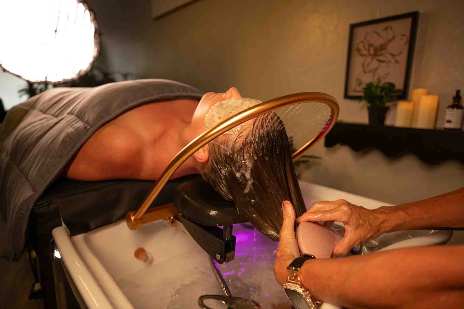 Kelley performing a HeadSpa water treatment at Kelley Ann Brackett Salon