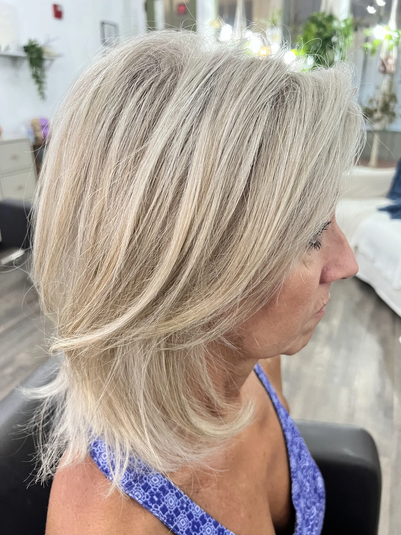 A softly layered light-toned hairstyle by Kelley