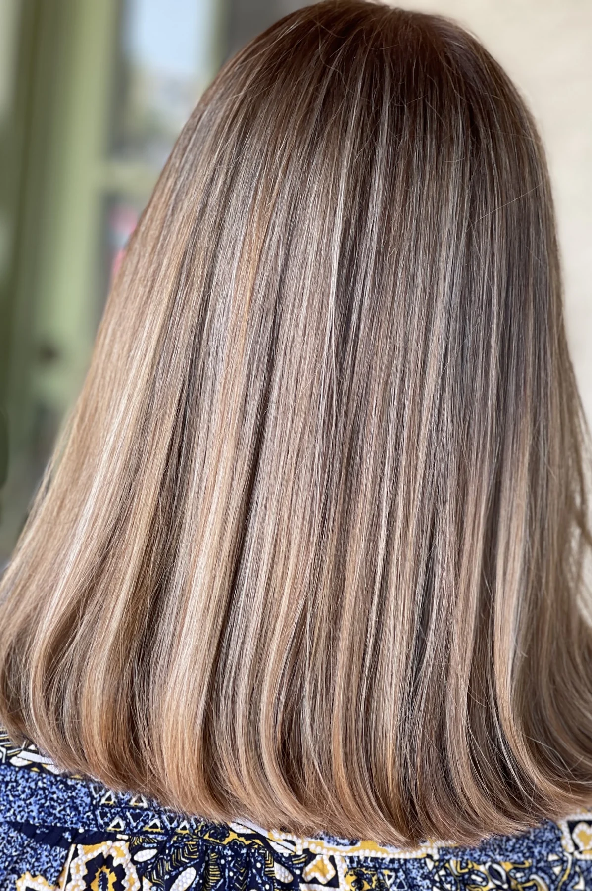 Close-up of the curved shape of a short brunette bob