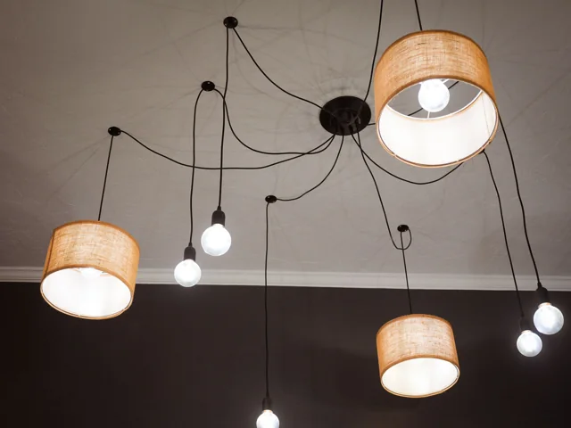 Warm pendant lights over the styling stations